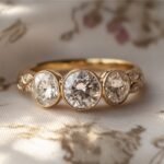 Which famous historical figure popularized the sapphire and diamond three-stone ring