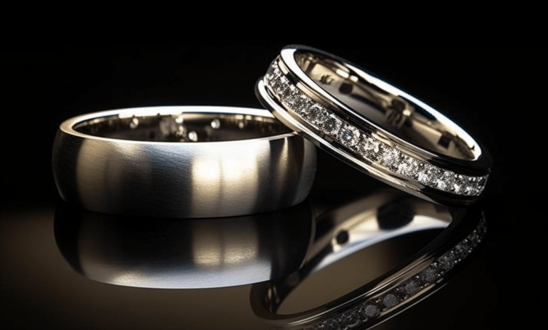 Couple looking at engagement and wedding rings