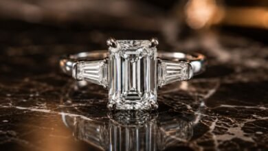 Emerald Cut Engagement Rings 65 Emerald cut diamond engagement ring close up on dark marble