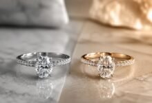 Two oval diamond engagement rings on marble, comparing lab-grown and natural diamond ring styles