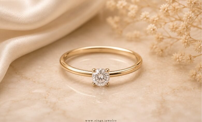 Thin band engagement ring with delicate gold band, secure diamond setting, and elegant daily wear style